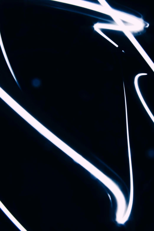 a close up of some lights in the dark, an album cover, inspired by Hans Hartung, unsplash, video art, white neon, very consistent bezier curves, low quality footage, laser light *