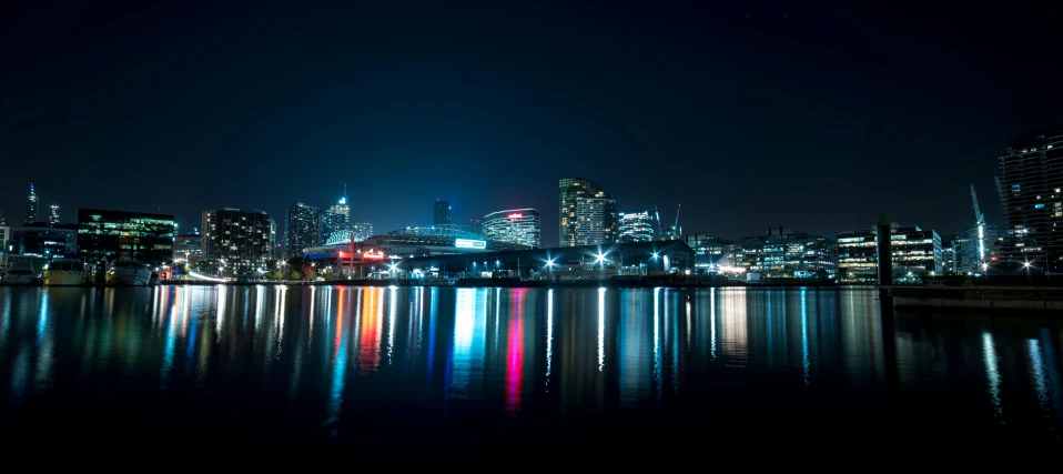 a large body of water next to a city at night, by Bascove, melbourne, fan favorite, full-color, high reflections