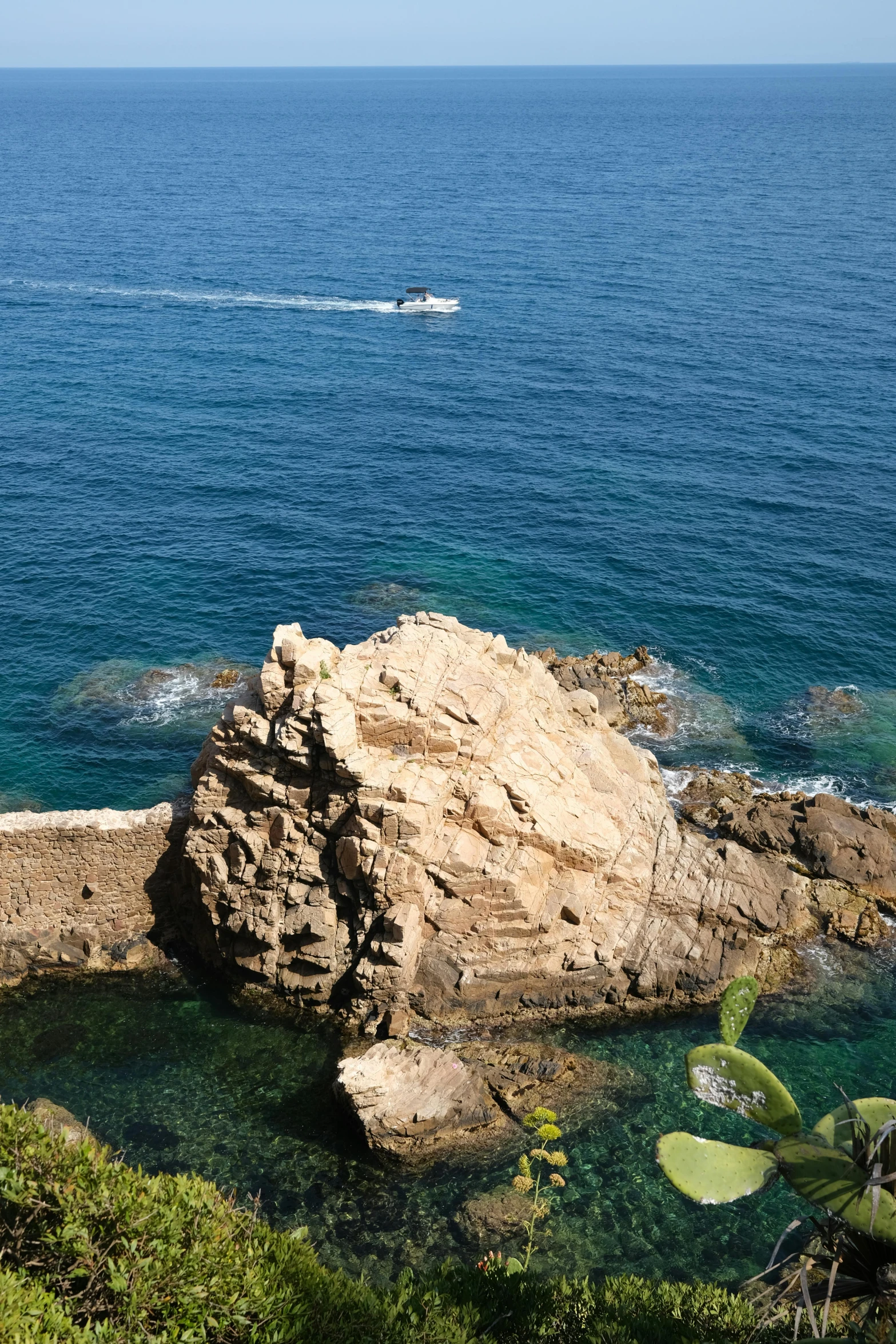 a large rock in the middle of a body of water, les nabis, overlooking the ocean, cannes, slide show, overview