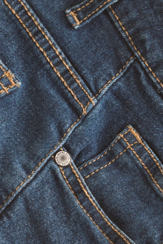 the back pocket of a pair of jeans, trending on pexels, pbr textures, detailed product image, zoomed, top down camera angle