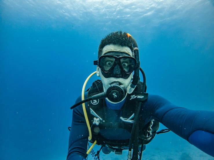a man in a scuba suit and goggles in the water, pexels contest winner, avatar image, instagram selfie, blue, action photograph