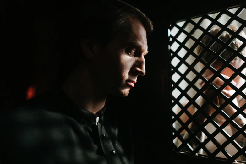 a close up of a person looking out a window, a character portrait, by Adam Marczyński, renaissance, sitting in a dark prison cell, cinematic outfit photo, linus from linustechtips, 15081959 21121991 01012000 4k