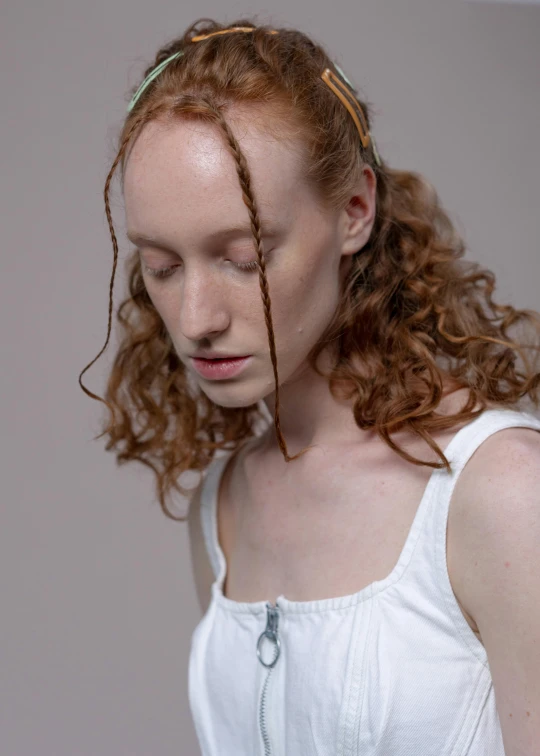 a woman with red hair wearing a white top, by Elizabeth Polunin, long braided curly hair, woman's face looking off camera, ignant, with a white complexion