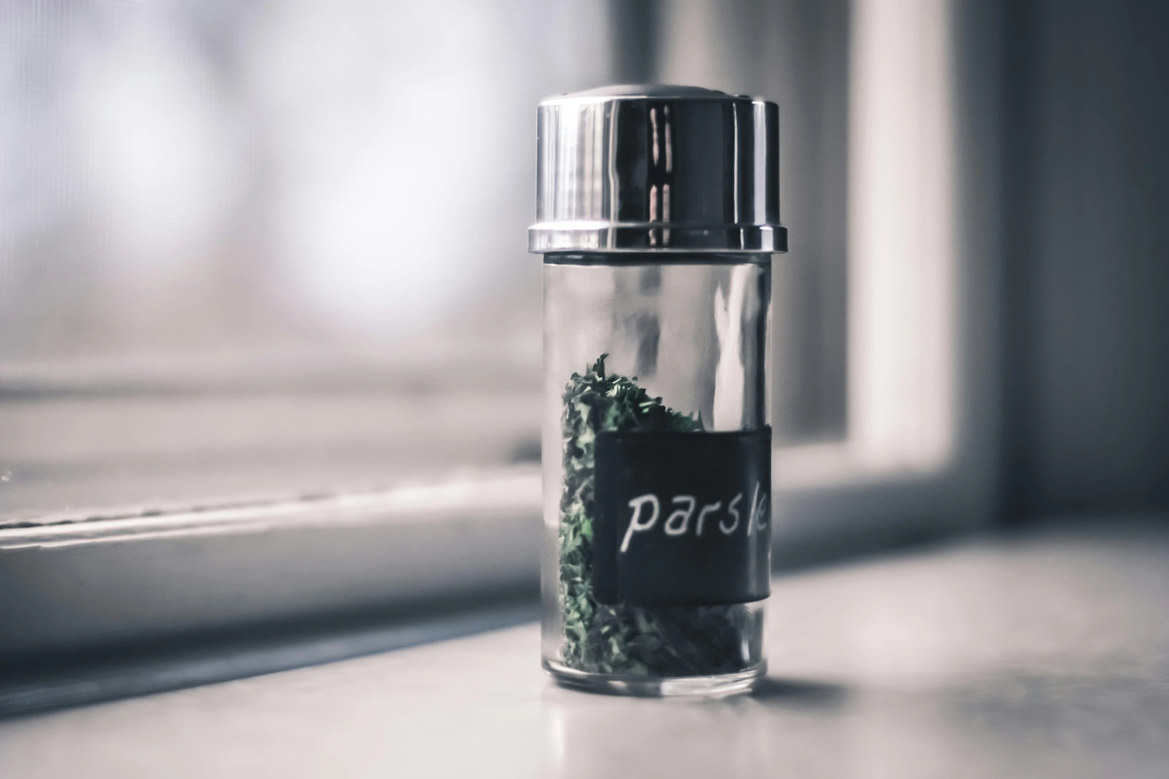 a jar of herbs sitting on a window sill, trending on pexels, purism, silver small small small glasses, paisley, paradise, fan favorite