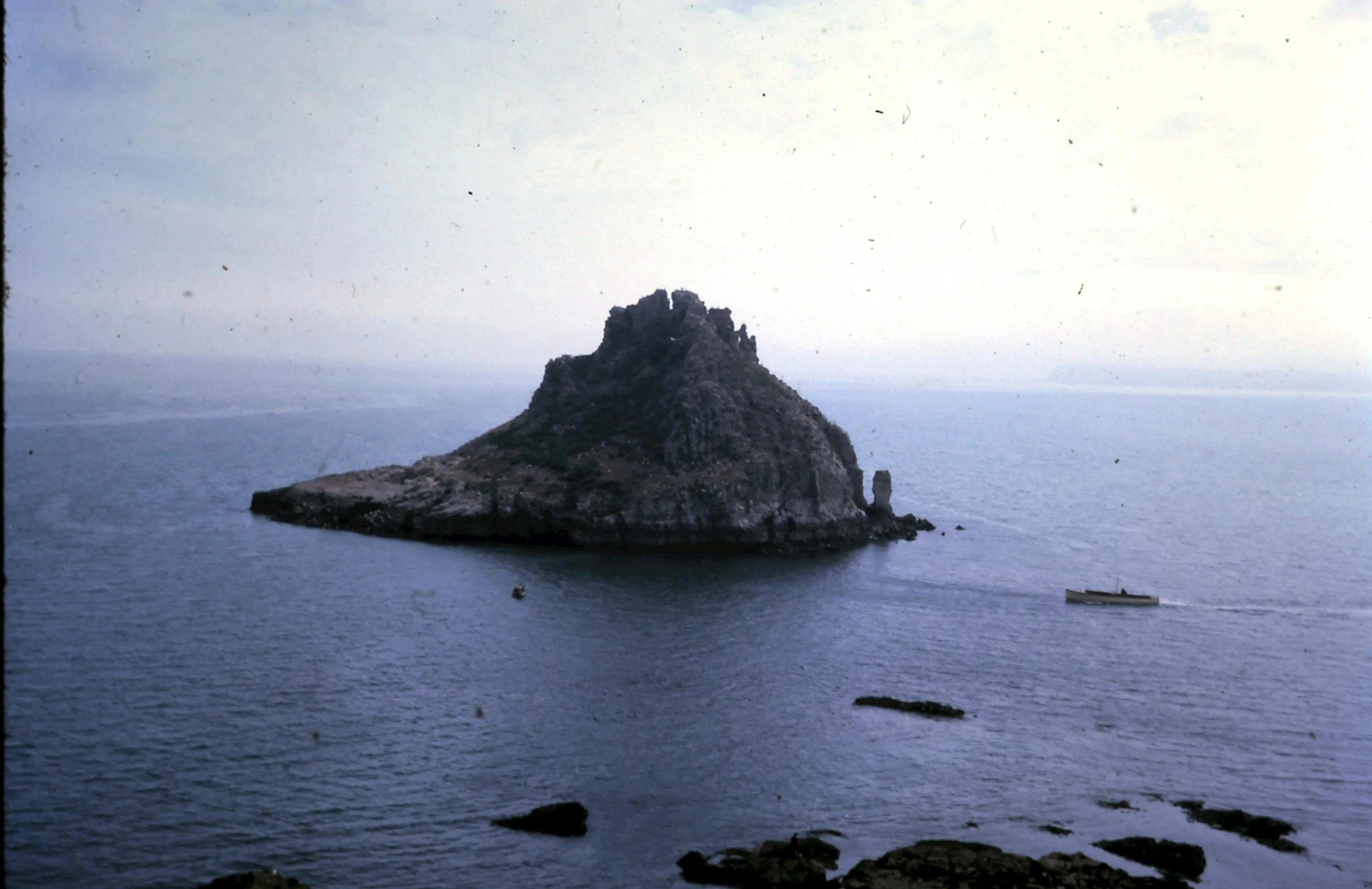 a small island in the middle of the ocean, a colorized photo, by Carlo Carrà, castle on the mountain, archived photograph, detailed medium format photo, stanly kubrick