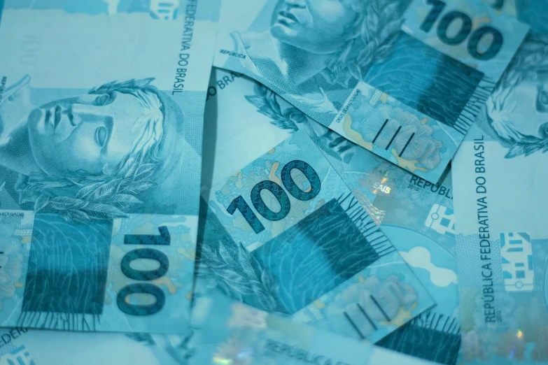 a pile of money sitting on top of a table, a digital rendering, by Amelia Peláez, pexels contest winner, rio de janeiro, blue colored, as cristina kirchner, lo fi