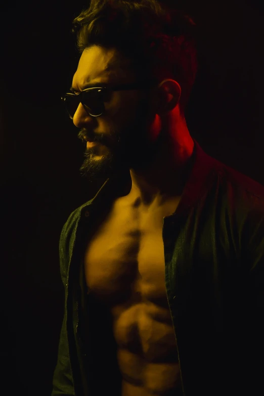 a shirtless man standing in the dark, an album cover, pexels, man with glasses, riyahd cassiem, bearded beautiful man, demon male