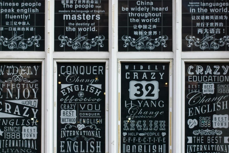 a bunch of signs that are on the side of a building, by Weiwei, international typographic style, photo of a beautiful window, vintage - w 1 0 2 4, english style, black chalk