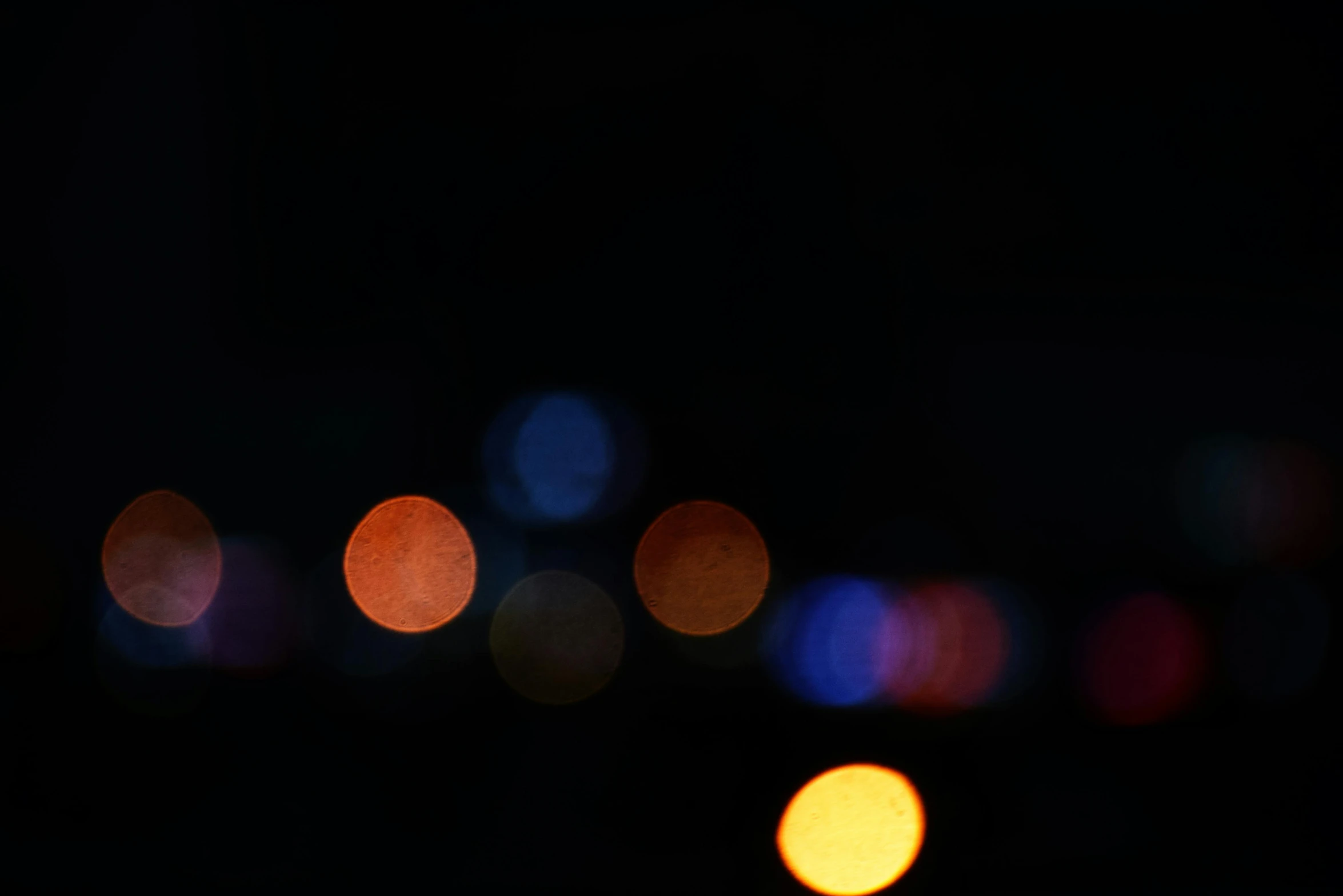 a blurry image of a city at night, a picture, unsplash, light and space, overcast bokeh - c 8, orbs, cinematic shot ar 9:16 -n 6 -g, close - up photograph