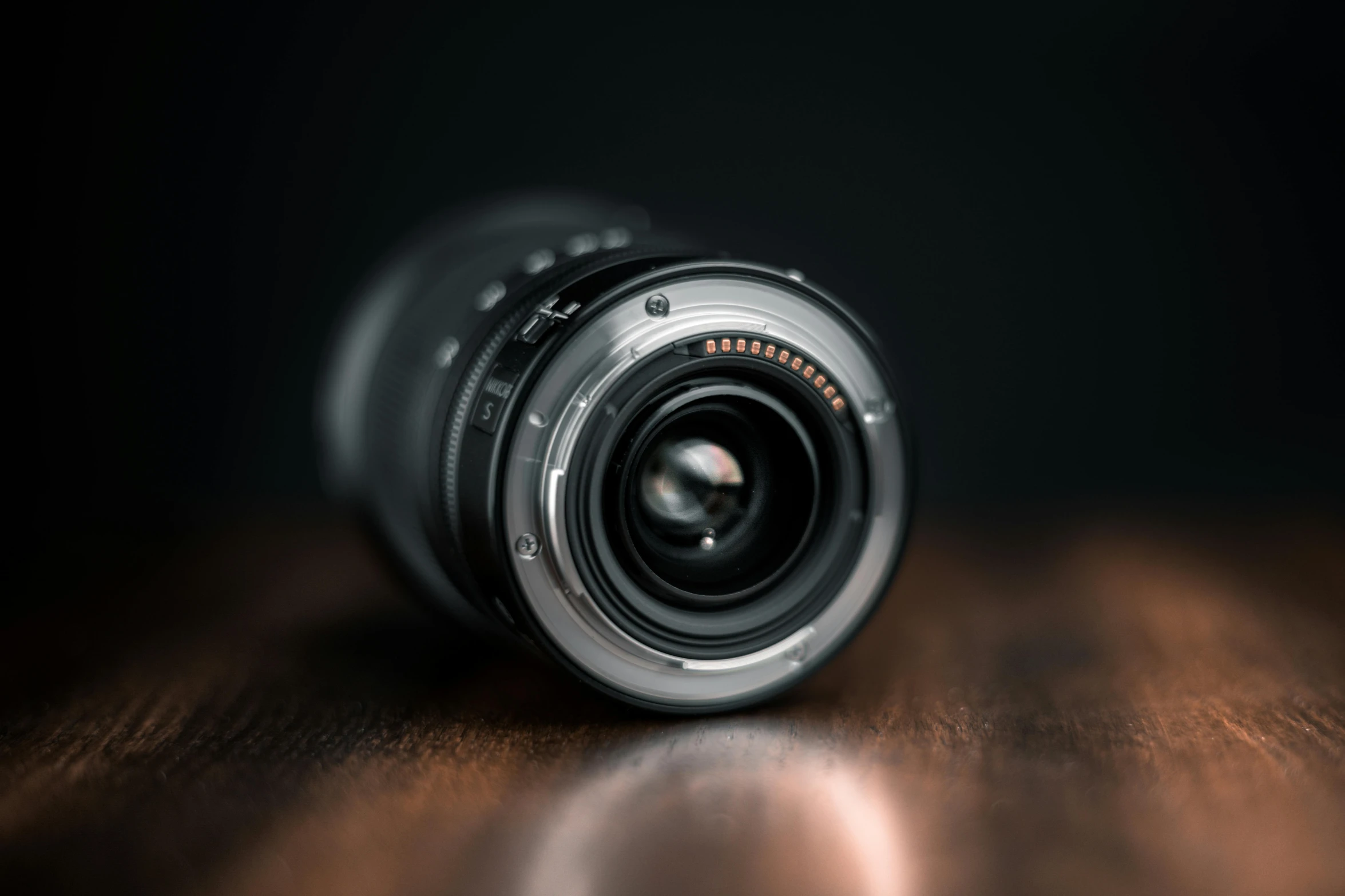 a camera lens sitting on top of a wooden table, by Thomas Häfner, unsplash, photorealism, depth of field!, hasselblad quality, !!! shallow depth of field!!!, 12mm wide-angle