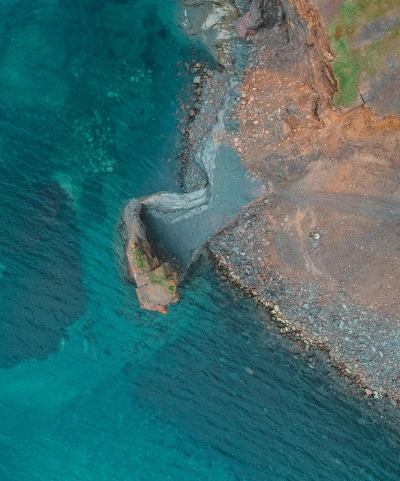 an aerial view of a large body of water, by Terese Nielsen, pexels contest winner, hurufiyya, found on a volcano, dredged seabed, half turned around, earthwave