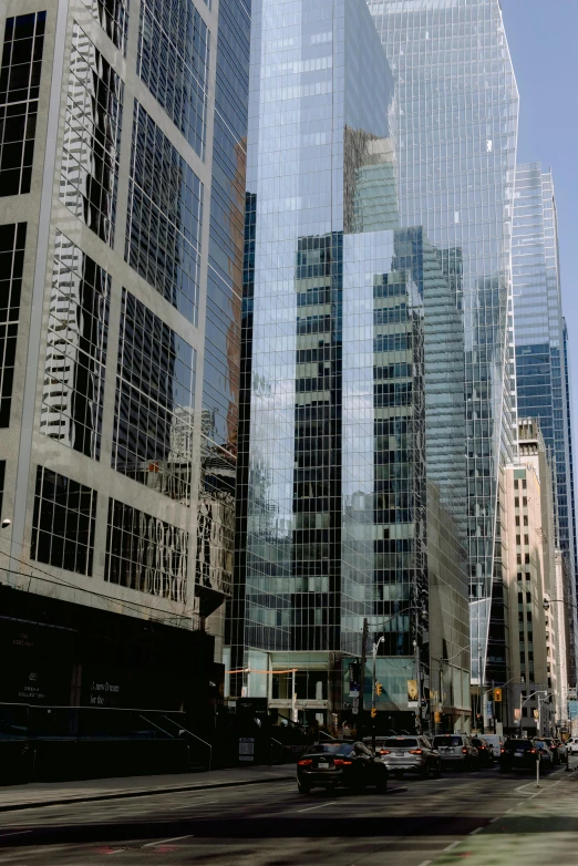 a city street filled with lots of tall buildings, a picture, inspired by Thomas Struth, flickr, panfuturism, sleek glass buildings, 1999 photograph, toronto, panorama