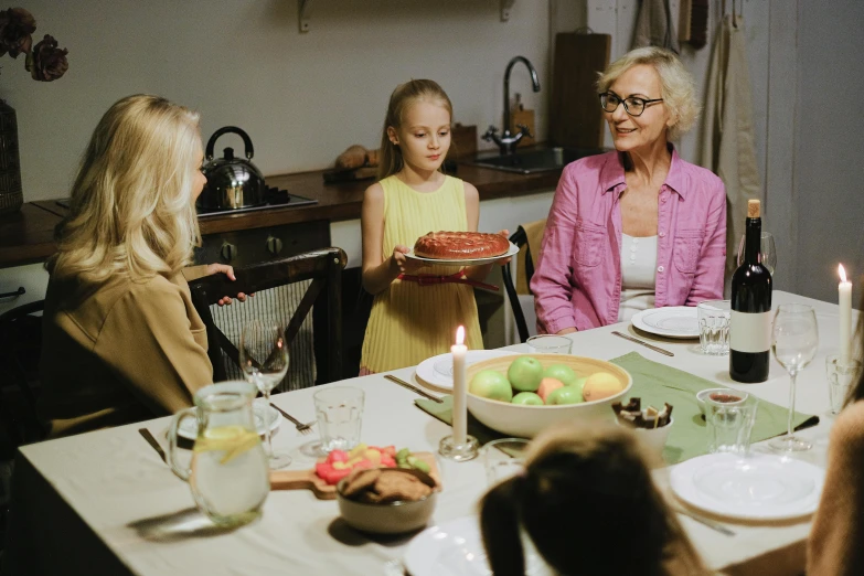 a group of people sitting around a dinner table, bowl filled with food, in the kitchen, profile image, fan favorite