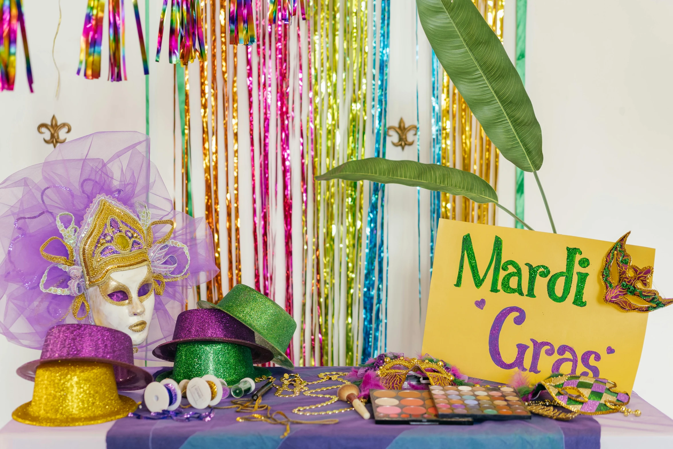 a table with a sign that says mardi gras, a portrait, shutterstock, decorations, portrait image, amanda lilleston, 1 petapixel image