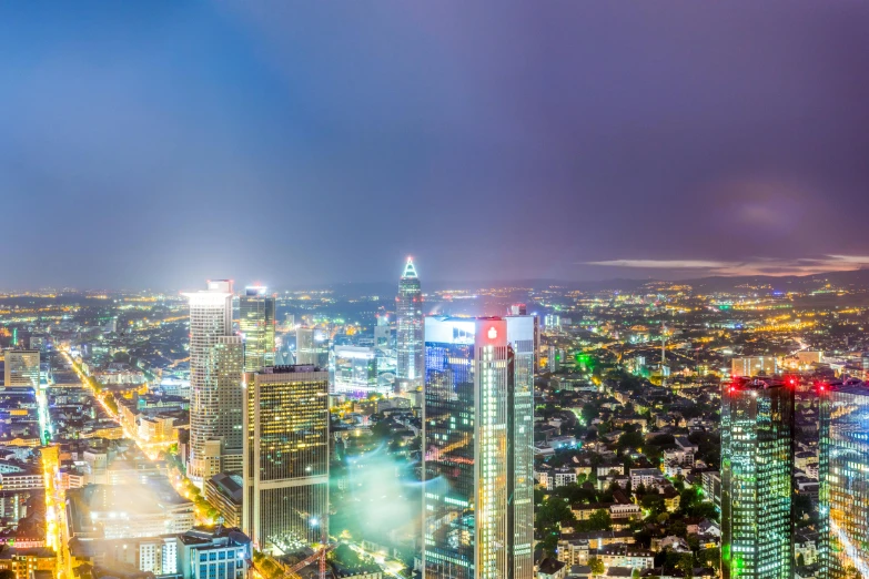 an aerial view of a city at night, pexels contest winner, bauhaus, panoramic widescreen view, thailand, germany. wide shot, bright neon lights from the city