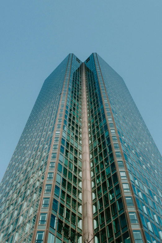 a very tall building with a lot of windows, inspired by Richard Wilson, pexels contest winner, ultrawide shots, ignant, clear blue skies, sins inc skyscraper front