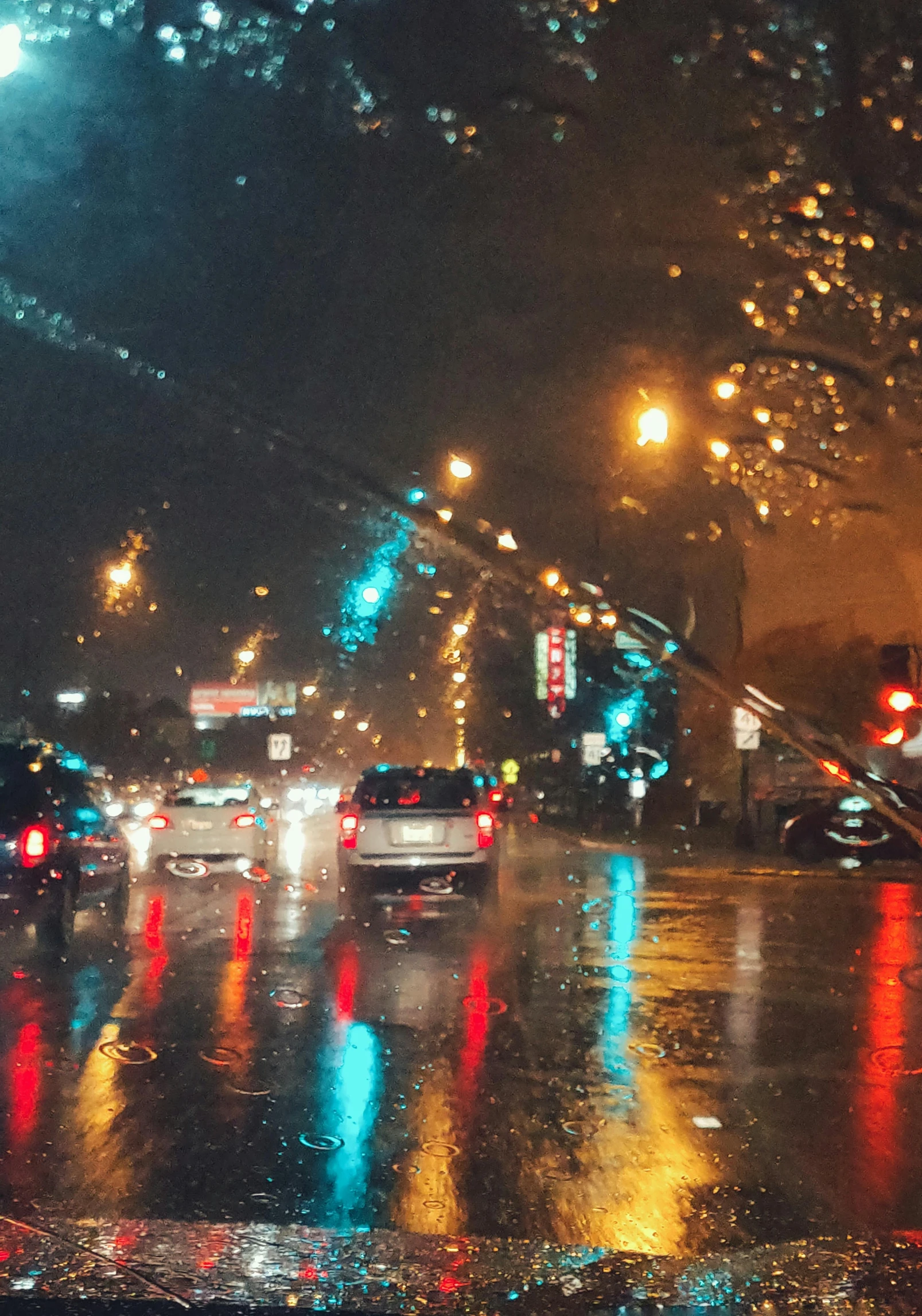 a city street filled with lots of traffic at night, an album cover, inspired by Elsa Bleda, trending on unsplash, visual art, downpour, dashcam footage, ☁🌪🌙👩🏾, modern chicago streets