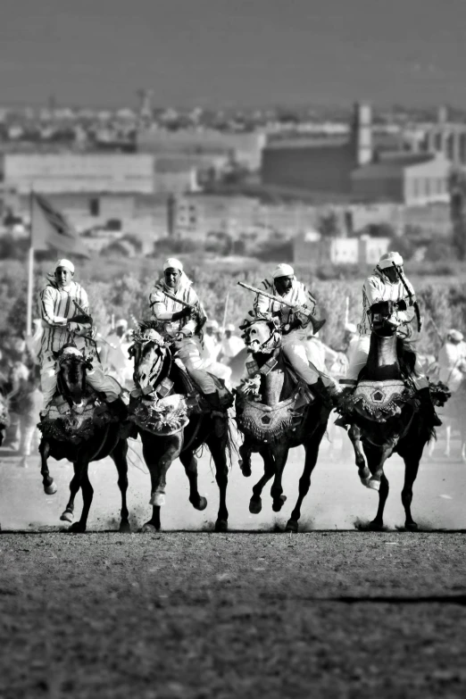 a group of men riding on the backs of horses, a black and white photo, arabesque, sport photography, “ golden cup, futuristic marrakech, a medieval