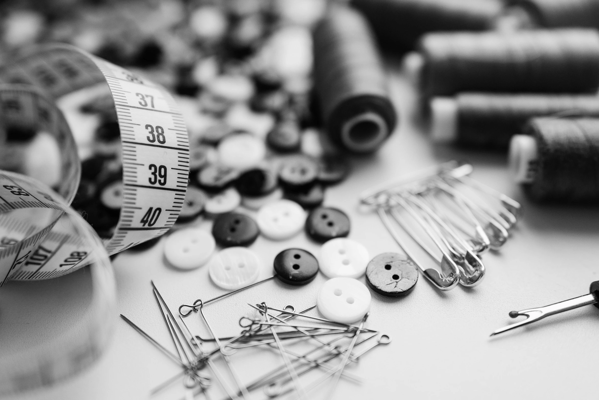 a bunch of sewing supplies sitting on top of a table, a black and white photo, by Kristian Zahrtmann, unsplash, button potenciometers, costume design made with love, measurements, acupuncture treatment