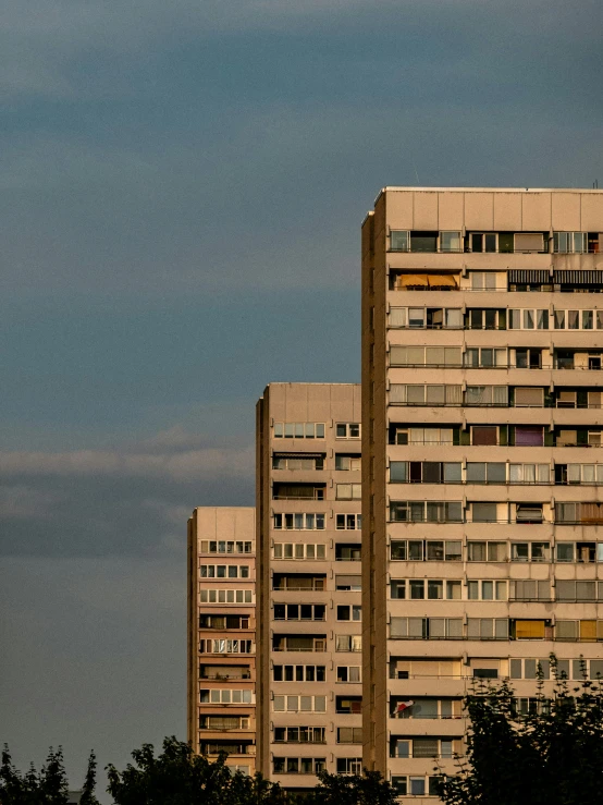 a couple of tall buildings sitting next to each other, by Sven Erixson, unsplash, brutalism, soviet suburbs, three - quarter view, high quality photo, horizont