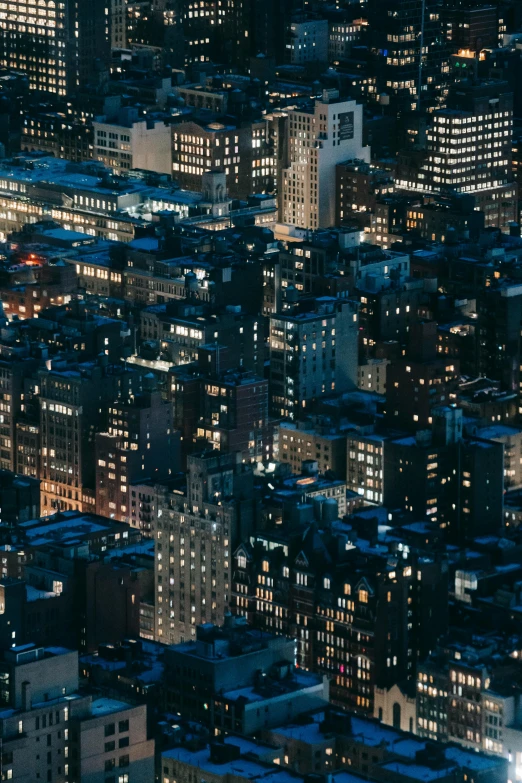 an aerial view of a city at night, inspired by Andreas Gursky, unsplash contest winner, new york buildings, 8 k detail, early evening, stacked buildings