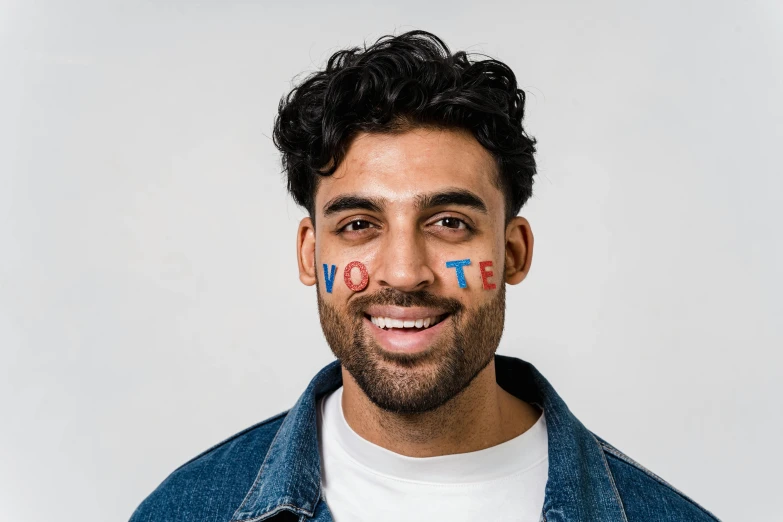 a man with a flag painted on his face, trending on pexels, graffiti, a portrait of rahul kohli, telegram sticker, election poster, background image