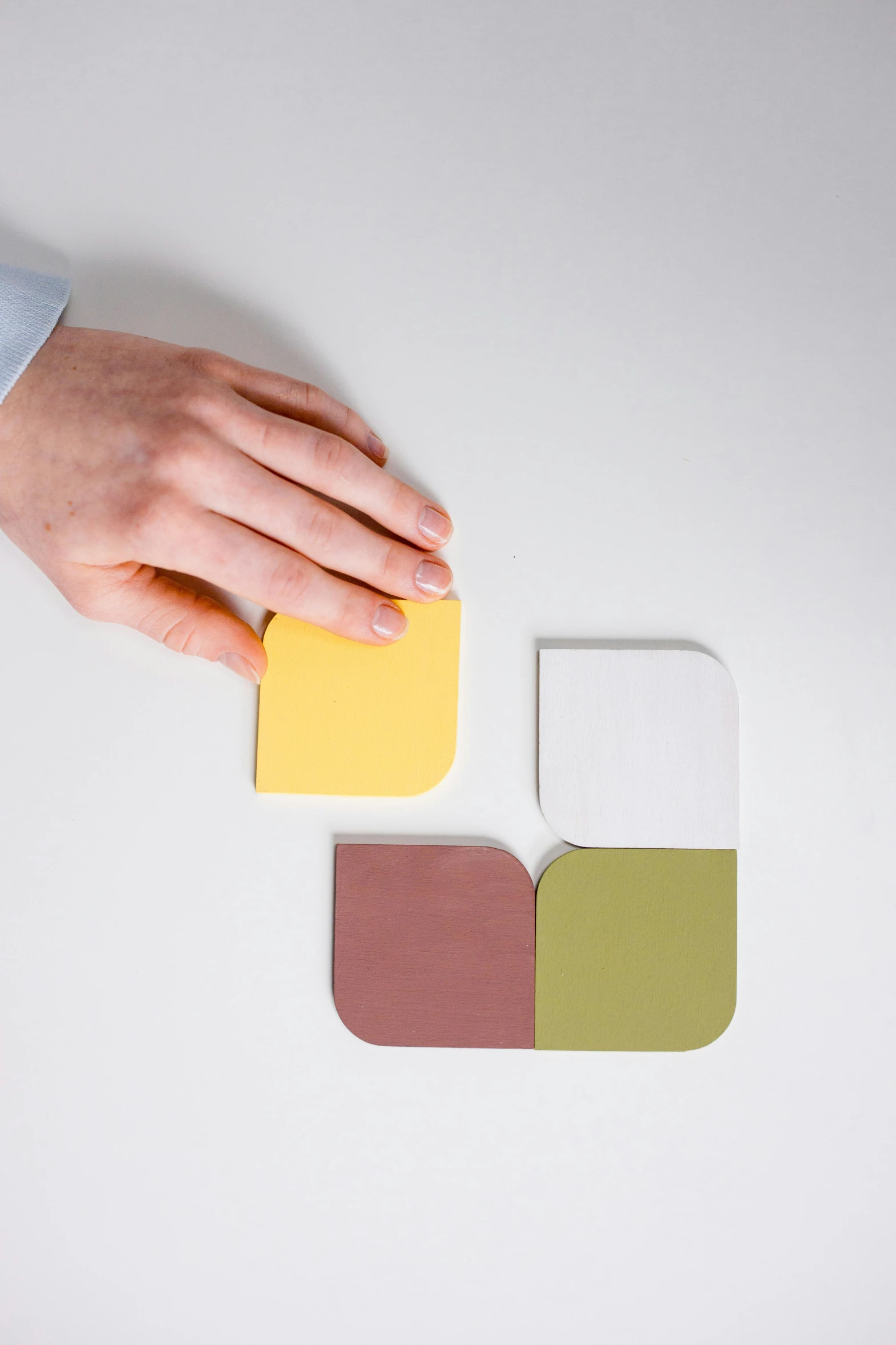 a person holding a piece of paper in one hand and a piece of paper in the other, inspired by Ellsworth Kelly, unsplash, color field, silicone patch design, square, brown, isometric view