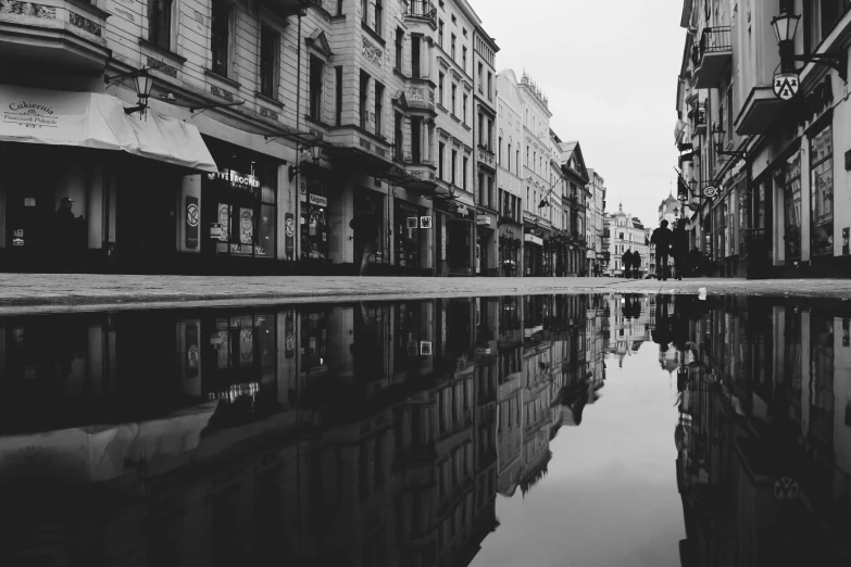 a black and white photo of a city street, by Emma Andijewska, pexels contest winner, minimalism, water reflection!!!!!, lviv, high quality upload, low detailed