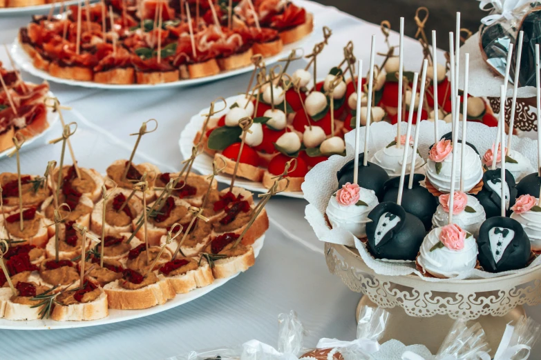 a table topped with lots of different types of food, by Tom Wänerstrand, unsplash, art nouveau, wedding, skewer, square, 15081959 21121991 01012000 4k