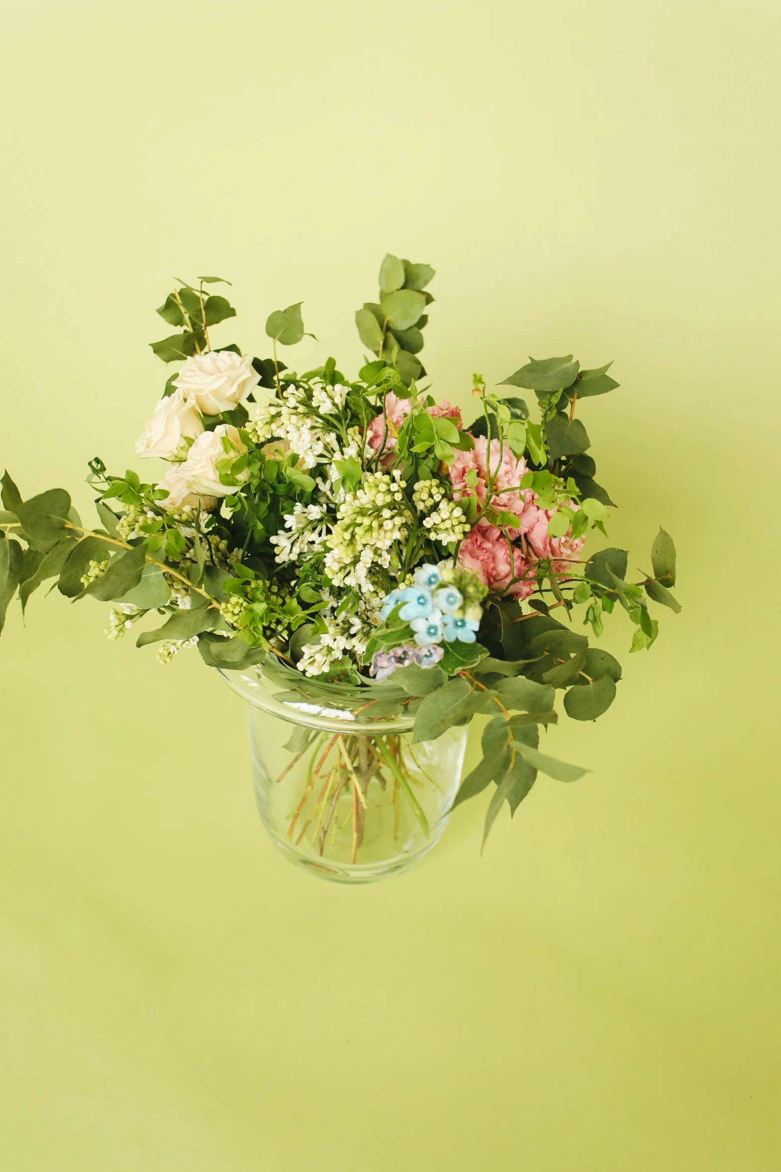 a vase filled with flowers sitting on top of a table, by Eden Box, gradient pastel green, sweet hugs, summer meadow, mix