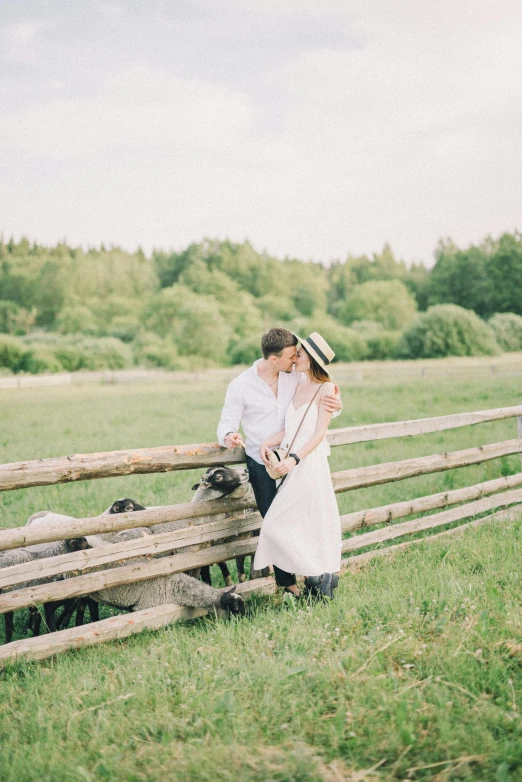 a man and woman standing next to a wooden fence, by Zofia Stryjenska, unsplash, romanticism, pastures, valentin serov style, 15081959 21121991 01012000 4k, instagram post