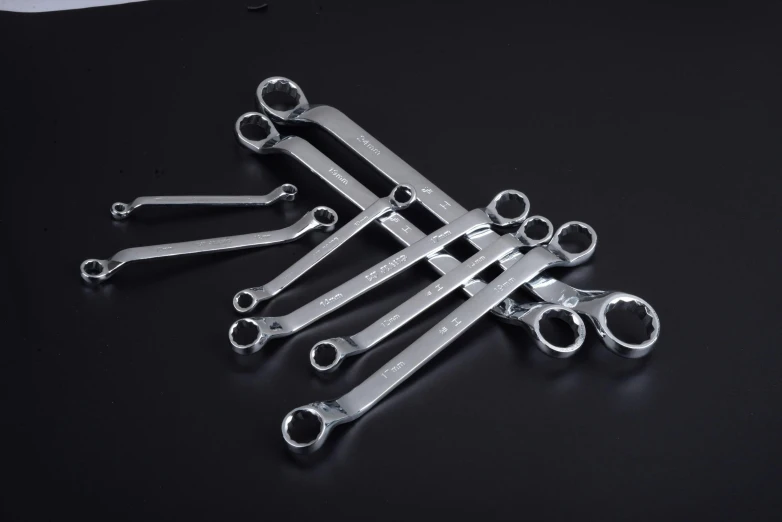 a bunch of wrenches sitting on top of a table, official product photo, silver small small small glasses, rb6s), daoshi