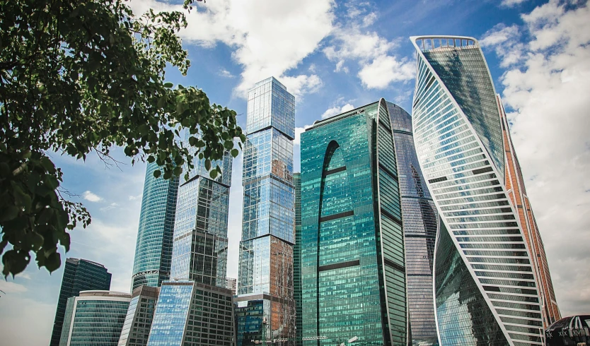 a group of tall buildings sitting next to each other, pexels contest winner, socialist realism, city of the future in russia, square, paler. millions of glass-walled, norman foster