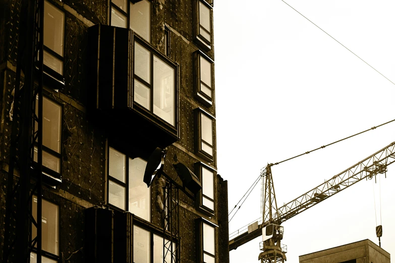 a black and white photo of a building under construction, inspired by Richard Wilson, unsplash, modular constructivism, cracked windows, brown, 2000s photo, ilustration