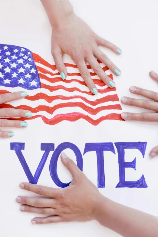 a group of people holding hands over a sign that says vote, by Harriet Zeitlin, splash image, painted nails, getty images, stars and stripes