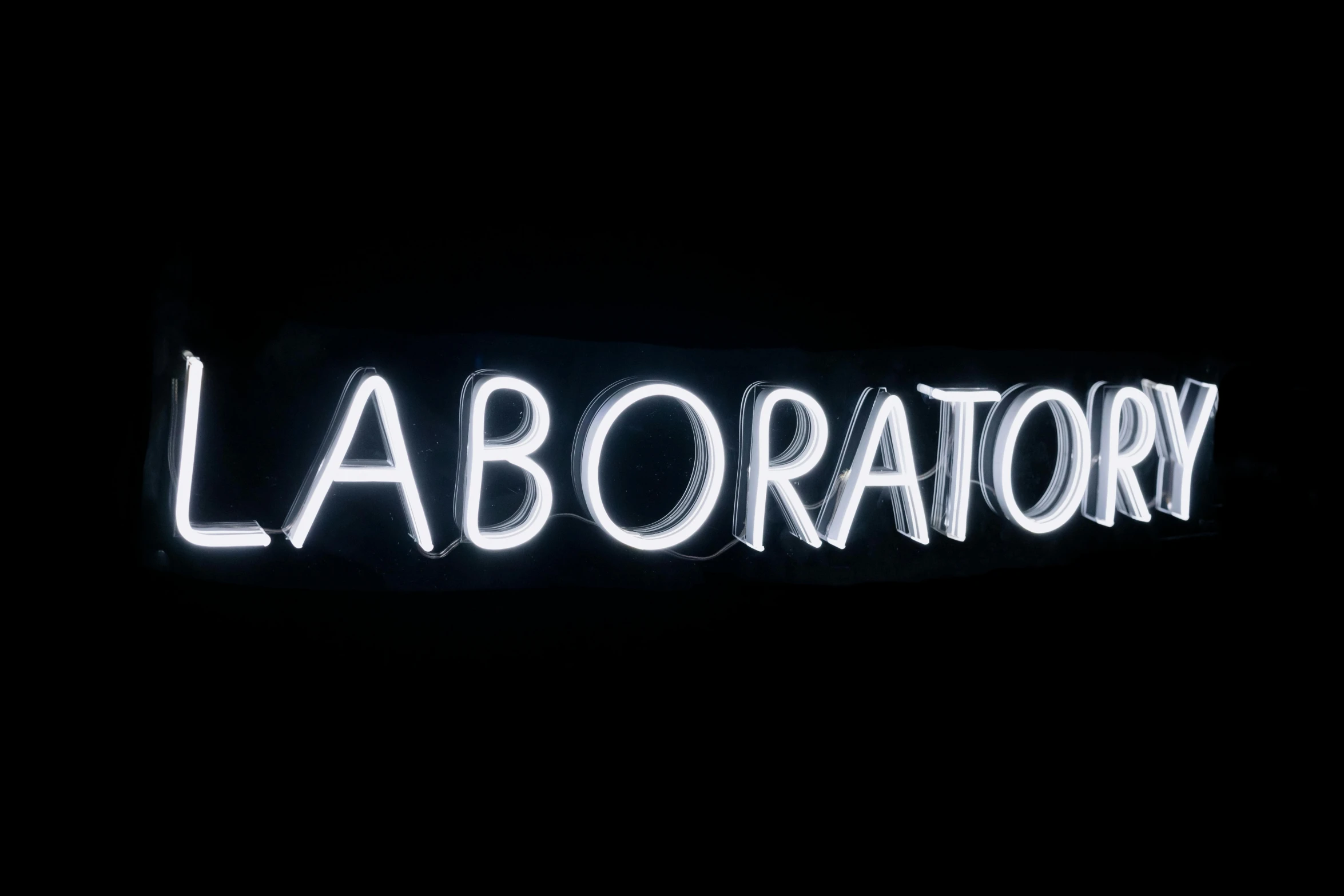 a close up of a neon sign in the dark, clean white lab background, laser light *, ultrastation hq, labrador