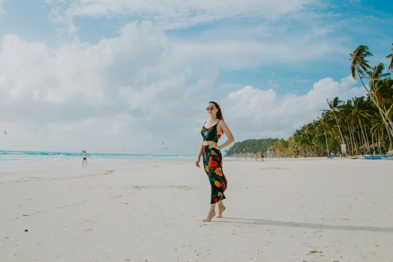 a woman standing on top of a sandy beach, standing on a beach in boracay, profile image, avatar image, outfit photo