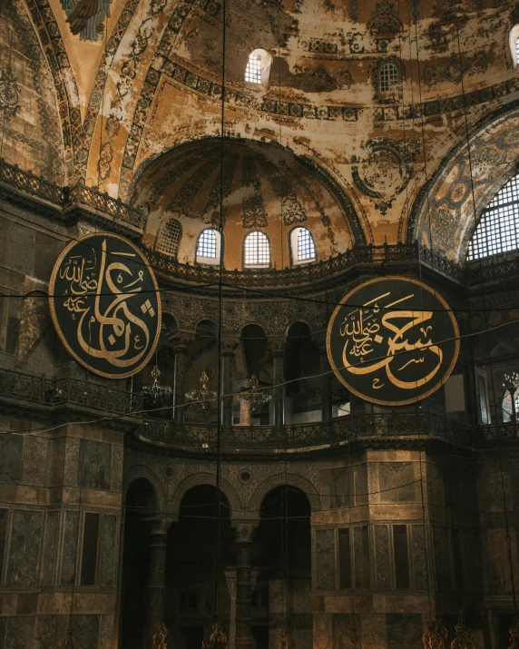 a group of people standing inside of a building, inspired by Osman Hamdi Bey, unsplash contest winner, graffiti, mosque interior, calligraphic poetry, dome, gif