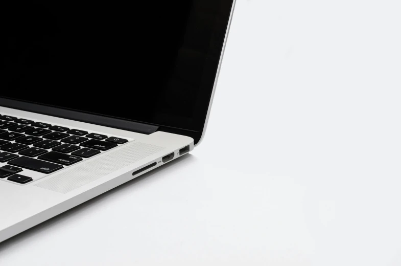 a laptop computer sitting on top of a white table, pexels, very sparse detail, ignant, white and black, ultra precise