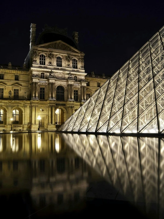a large glass pyramid in front of a building, a photo, pexels contest winner, renaissance, set at night, visa pour l'image, sharp detailed reflections, slide show