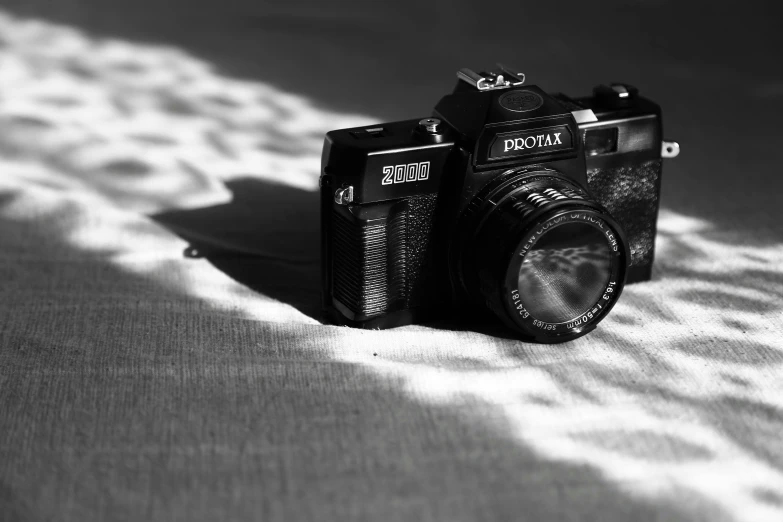 a black and white photo of a camera, pixabay contest winner, photorealism, 35mm!!! 1990, medium format. soft light, profile picture, photographic print