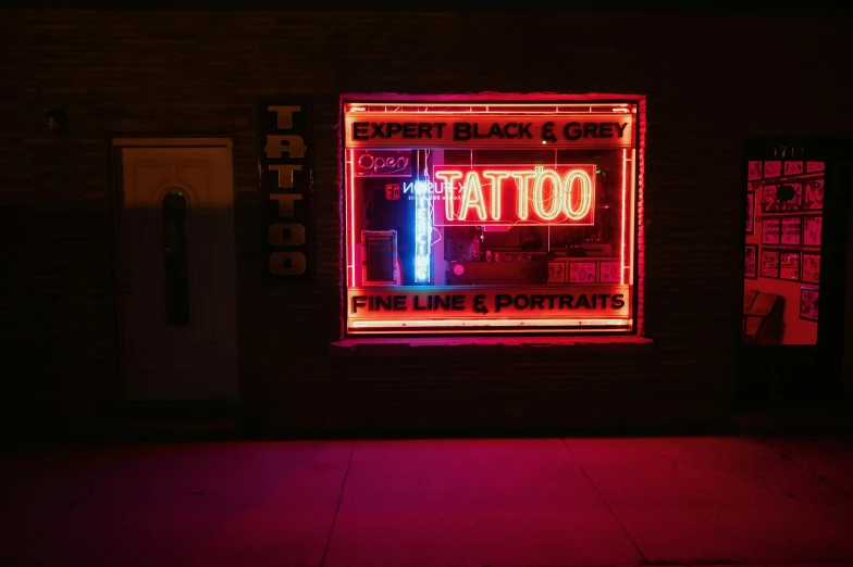 a neon sign in the window of a tattoo shop, a tattoo, pexels contest winner, hyperrealism, todd hido, black ink, oriental tattoos