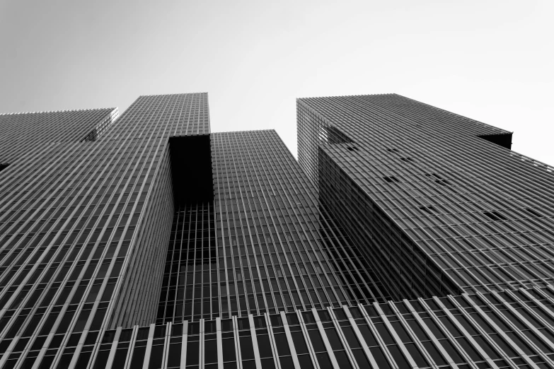 a black and white photo of a tall building, a black and white photo, pexels contest winner, mies van der rohe, three towers, extreme high quality, square shapes
