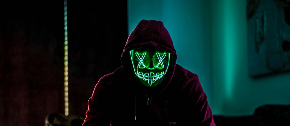 a person in a dark room with a neon mask on, pexels contest winner, green hood, cyber songman, aaaaaaaaaaaaaaaaaaaaaa, avatar image