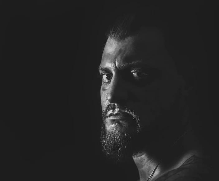 a black and white photo of a man with a beard, a character portrait, by Adam Marczyński, pexels, portrait of ernest khalimov, sith lord. dramatic lighting, real life photo of a syrian man, medium portrait top light