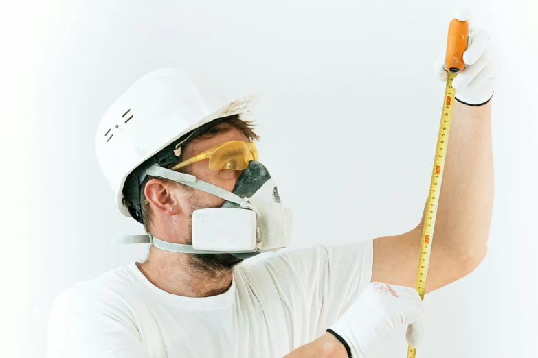 a man in a hard hat holding a tape measure, pexels contest winner, arbeitsrat für kunst, mask inside mask, white space, instagram post, 2045