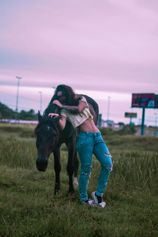 a woman standing next to a horse in a field, an album cover, inspired by Elsa Bleda, pexels contest winner, badass pose, highway, tattooed, ( ( ( synthwave ) ) )