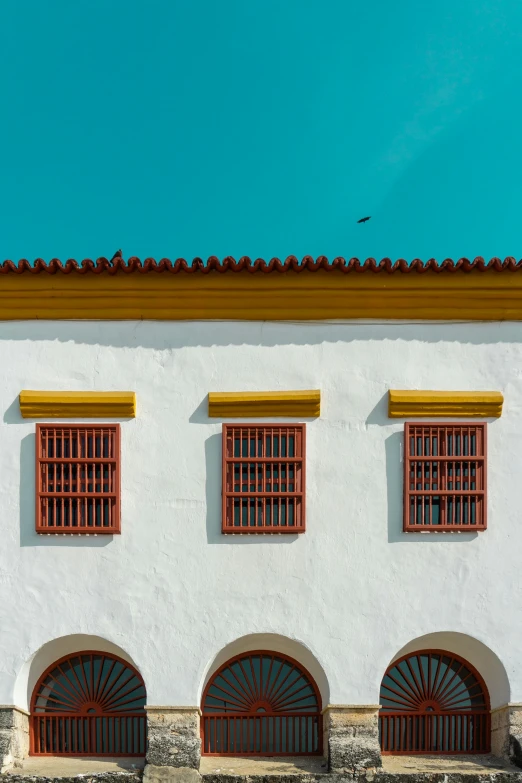 a red fire hydrant sitting in front of a white building, inspired by Luis Paret y Alcazar, trending on unsplash, quito school, cyan shutters on windows, peaked wooden roofs, three colors, square