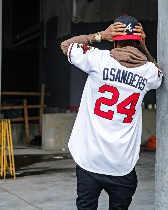 a man that is standing on a skateboard, by Dennis Flanders, trending on unsplash, graffiti, baseball player mike trout, showing her shoulder from back, homelander, official store photo