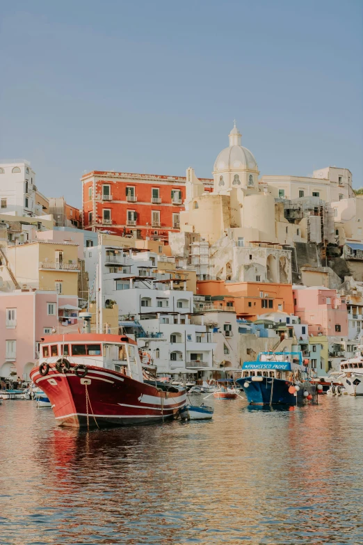 a number of boats in a body of water, by Patrick Pietropoli, pexels contest winner, renaissance, brightly colored buildings, pastel hues, viewed from the ocean, slide show